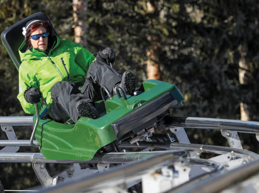 Lady in green riding mountain coaster