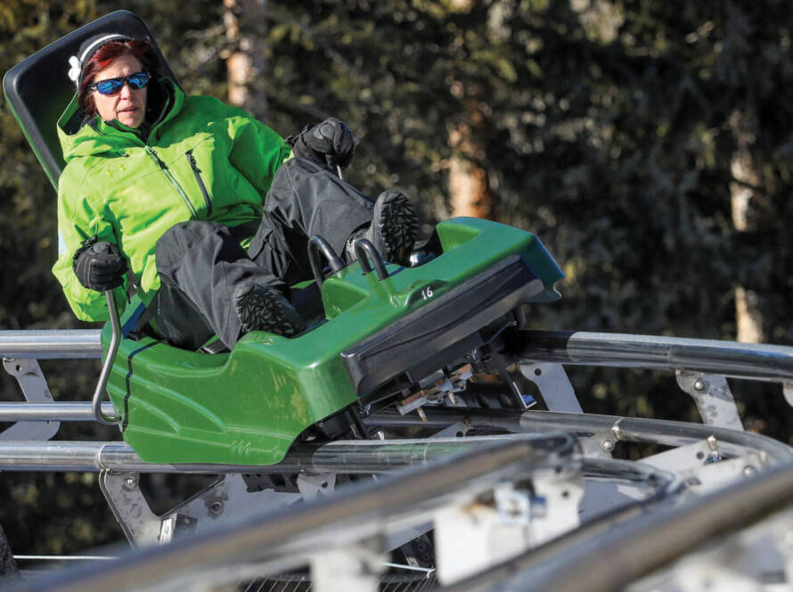 Lady in green riding mountain coaster