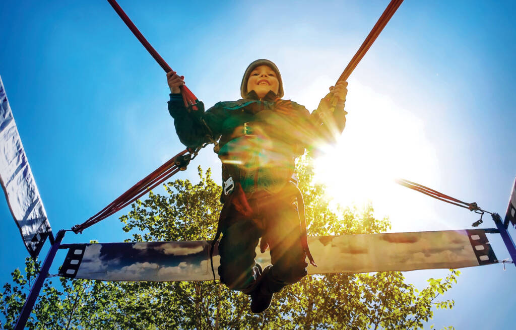 Boy on bouncy contraption