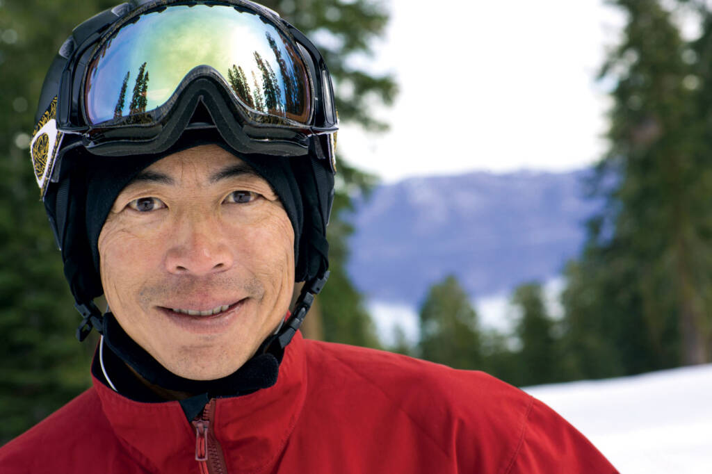 Man with ski goggles smiling