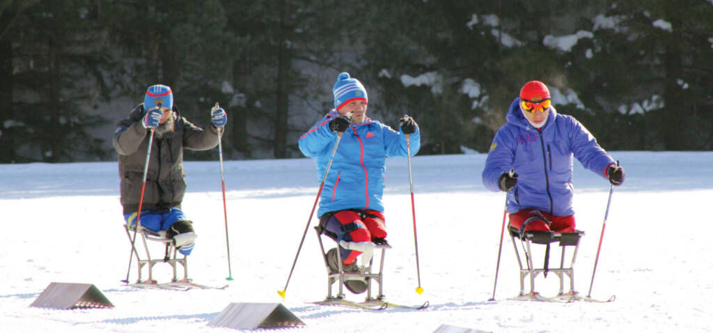 Three people on skis