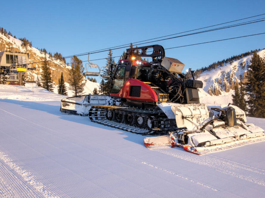 Winch Cat grooming machine parked at base of mountain