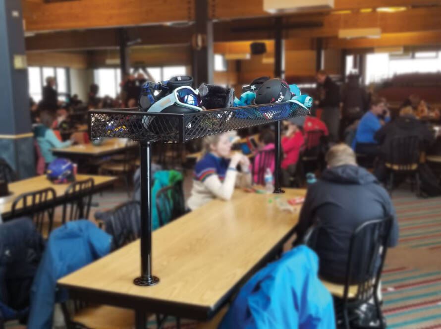 Clutter™ Basket attached to tabletop with patrons sitting at tables