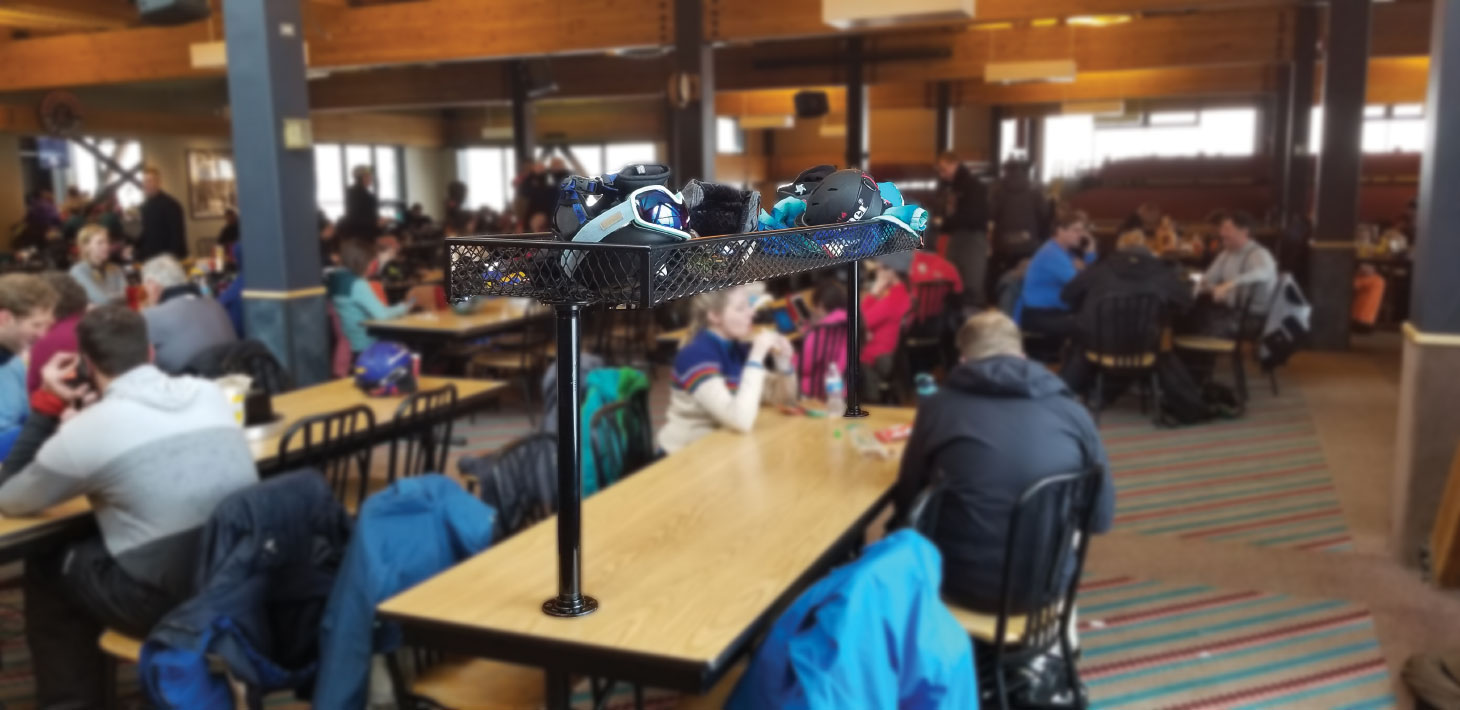 Clutter™ Basket attached to tabletop with patrons sitting at tables