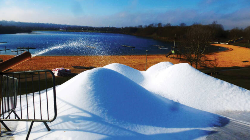 Piles of artificial snow being made by snowPRO all-weather snow system
