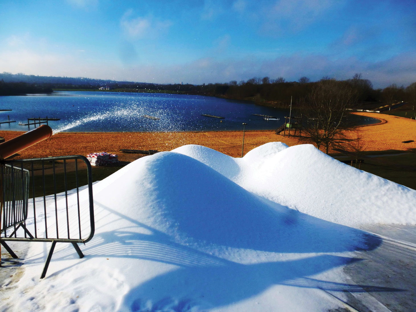 Piles of artificial snow being made by snowPRO all-weather snow system