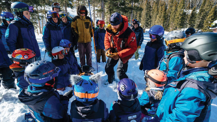 Handing out safety award in a group of skiers