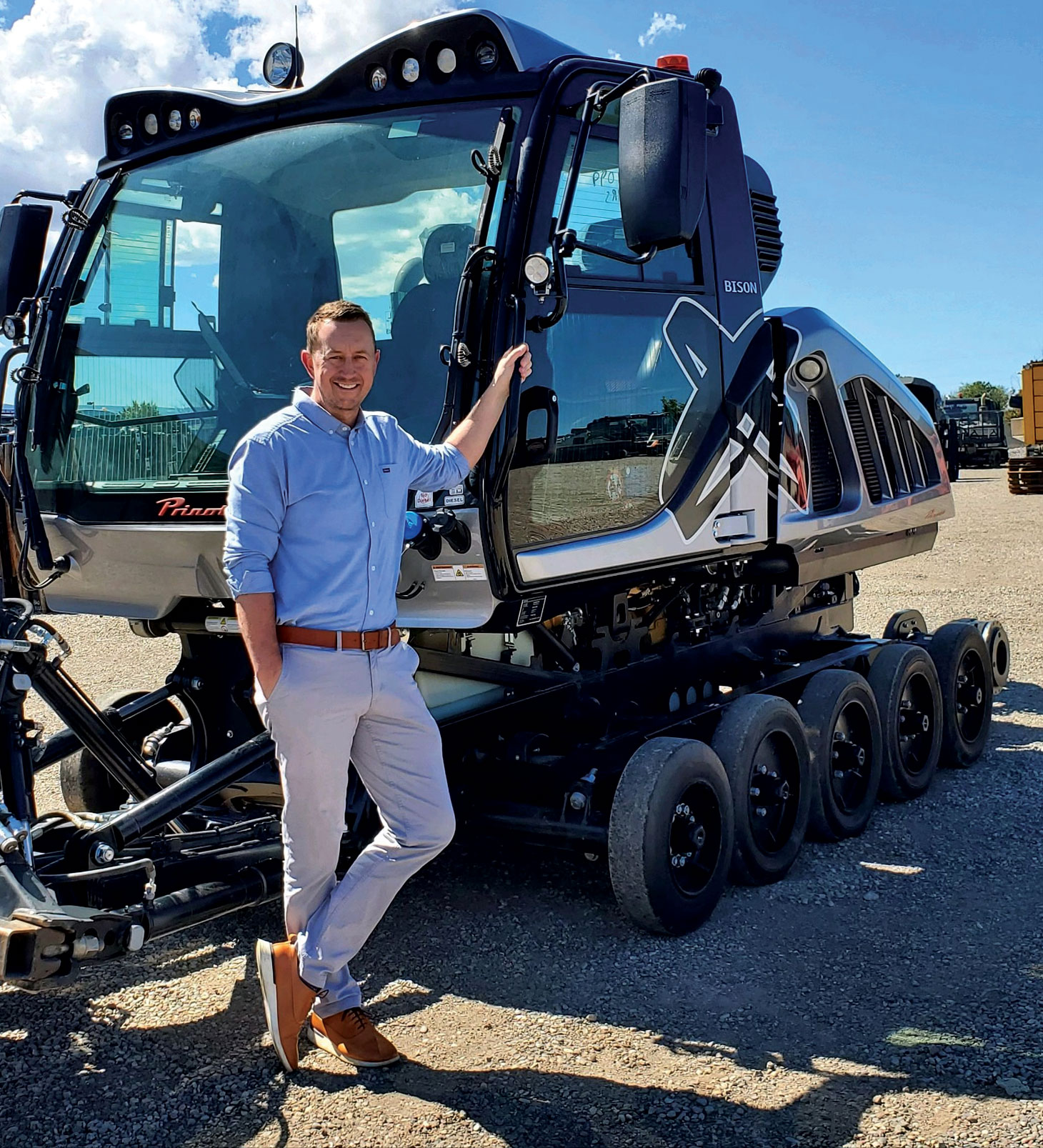 Photo of Scott Jones leaning against snow grooming equipment