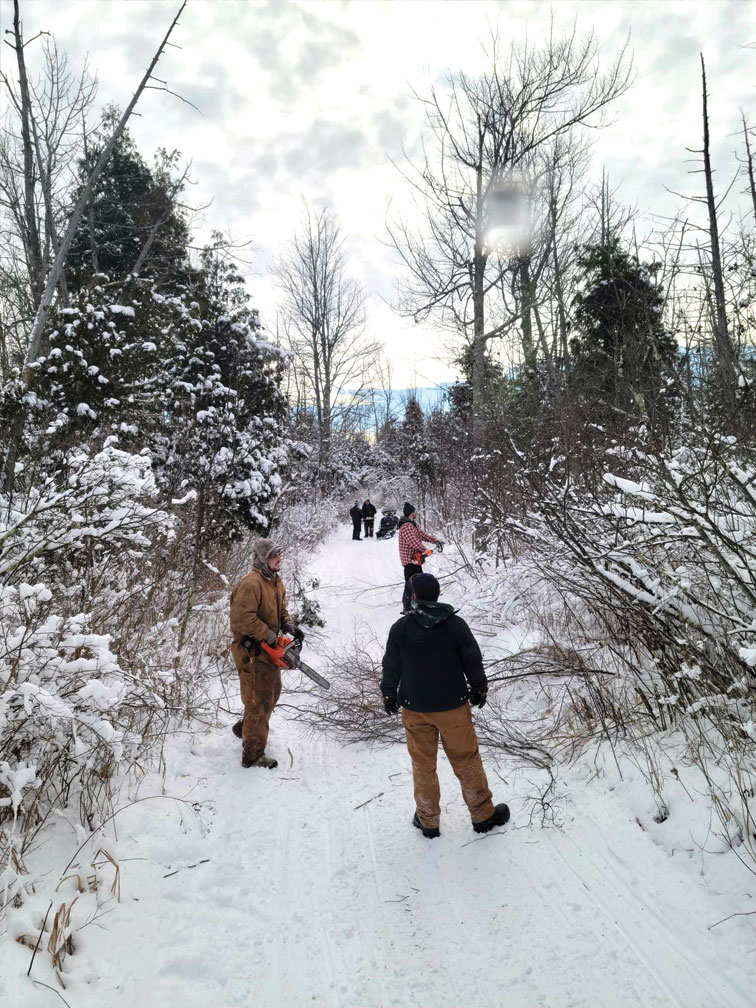 Members and volunteers cleaning up trails