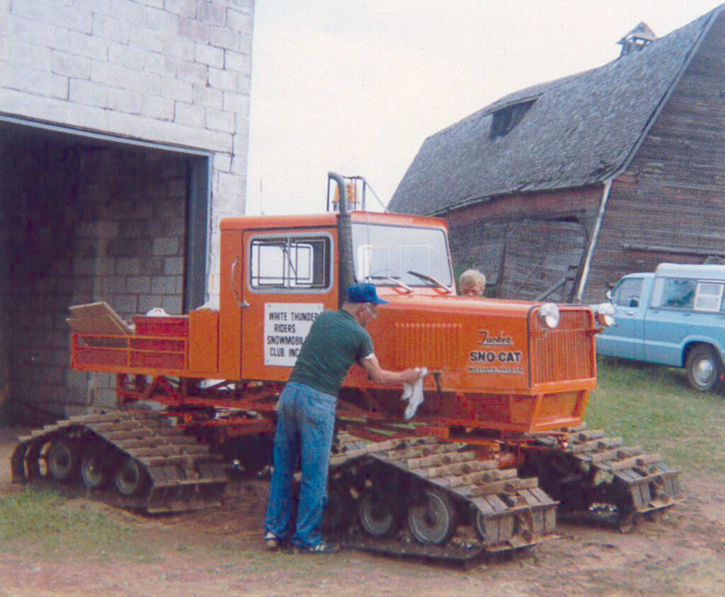 Toivo and Bobby Mattson cleaning up the club’s used Tucker Sno-Cat