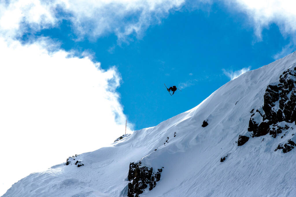 Skier jumping high in air