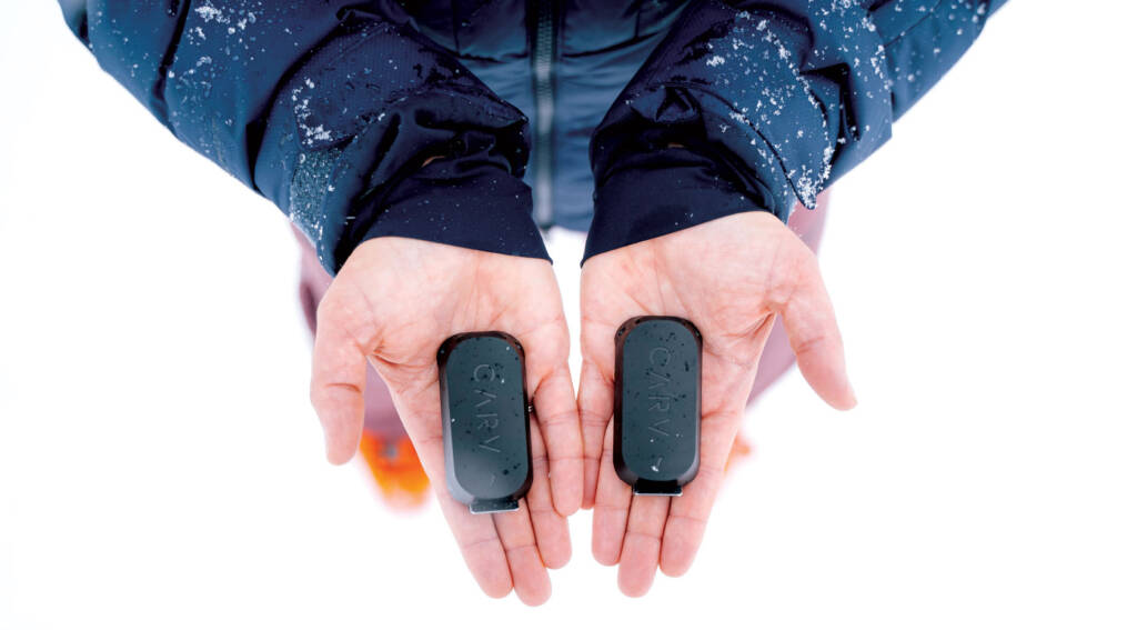 Person holding a Carv device in each open palm