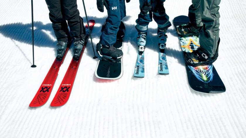 Photo of a group of skier and snowboarder equipment