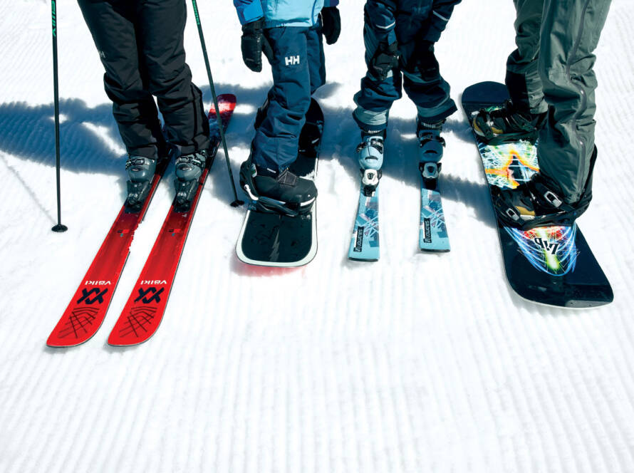 Photo of a group of skier and snowboarder equipment