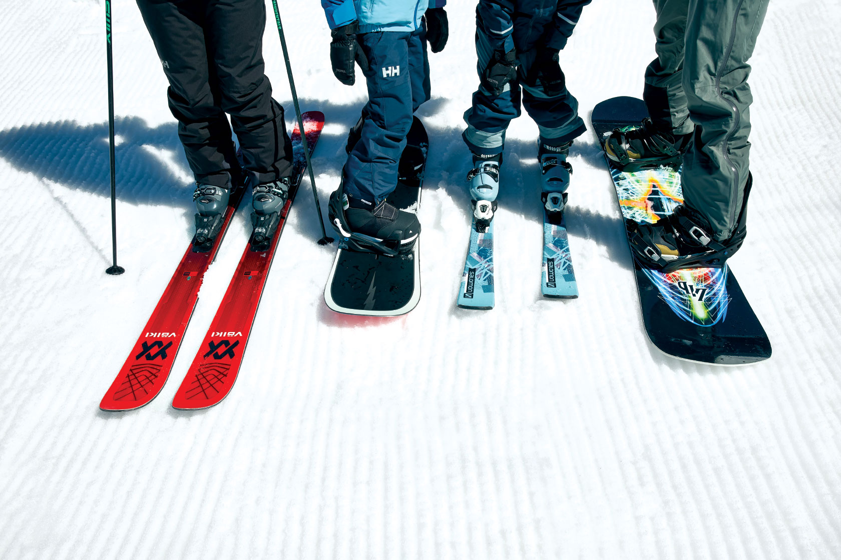 Photo of a group of skier and snowboarder equipment
