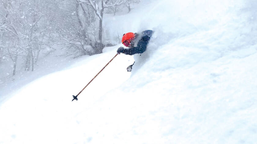 Joel Gratz skiing deep powder