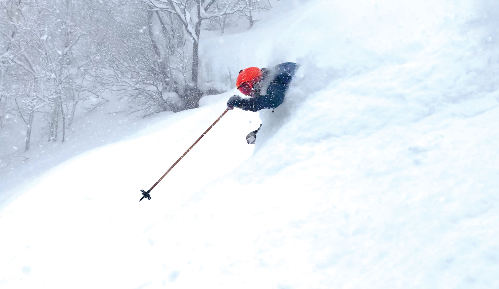 Joel Gratz skiing deep powder