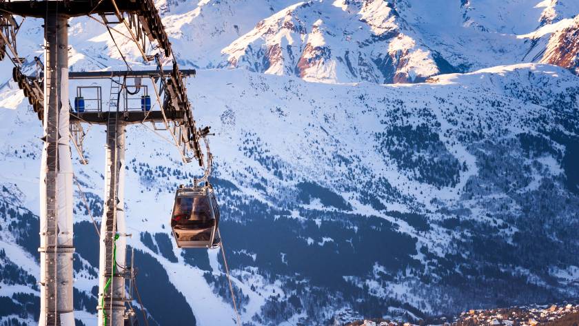 Gondola lift in ski resort in Alps mountains, France