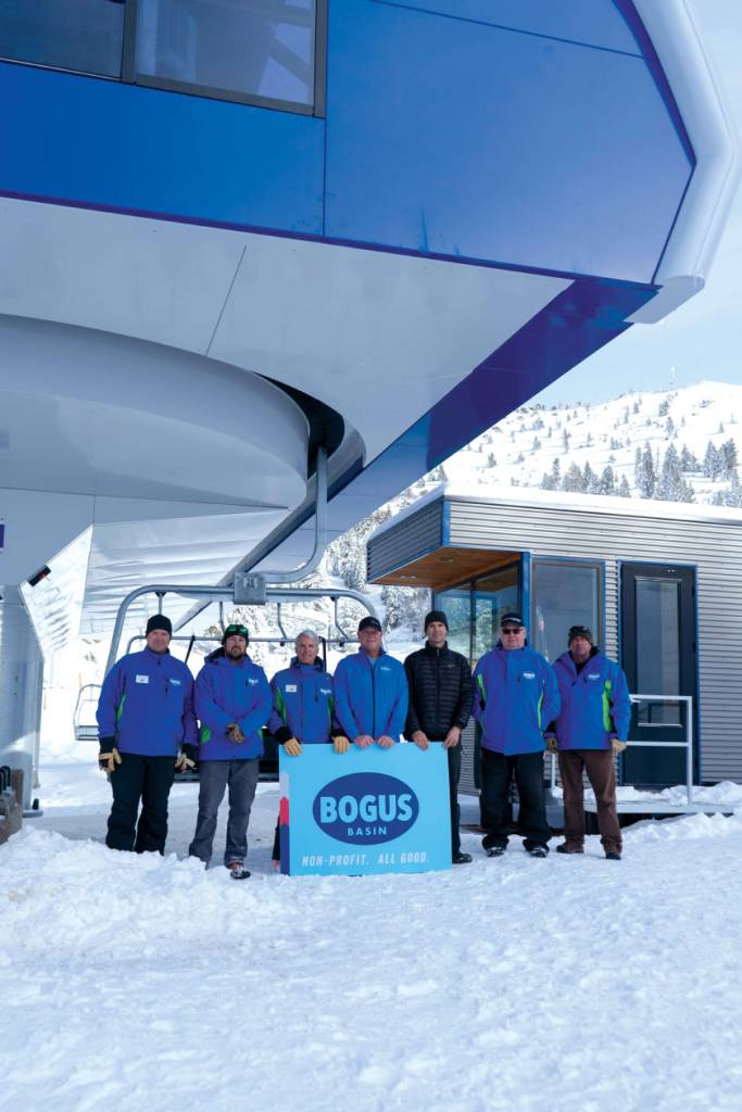 Staff gathered for photo beside new lift