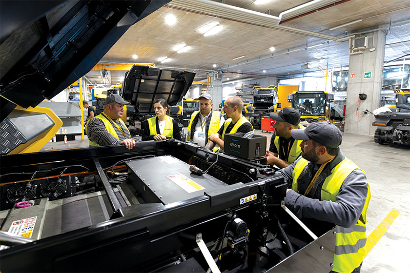 Group huddled around snowcat