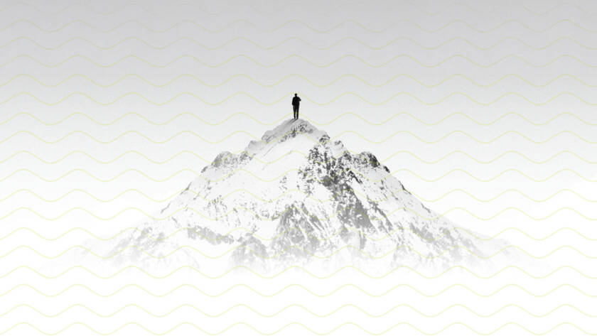 Digital composition of solitary person on snowy mountain summit