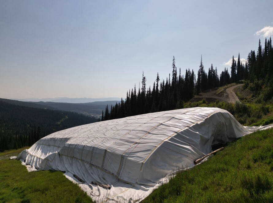 Snow Secure’s storage system securing snow in summer, surrounded by green grass