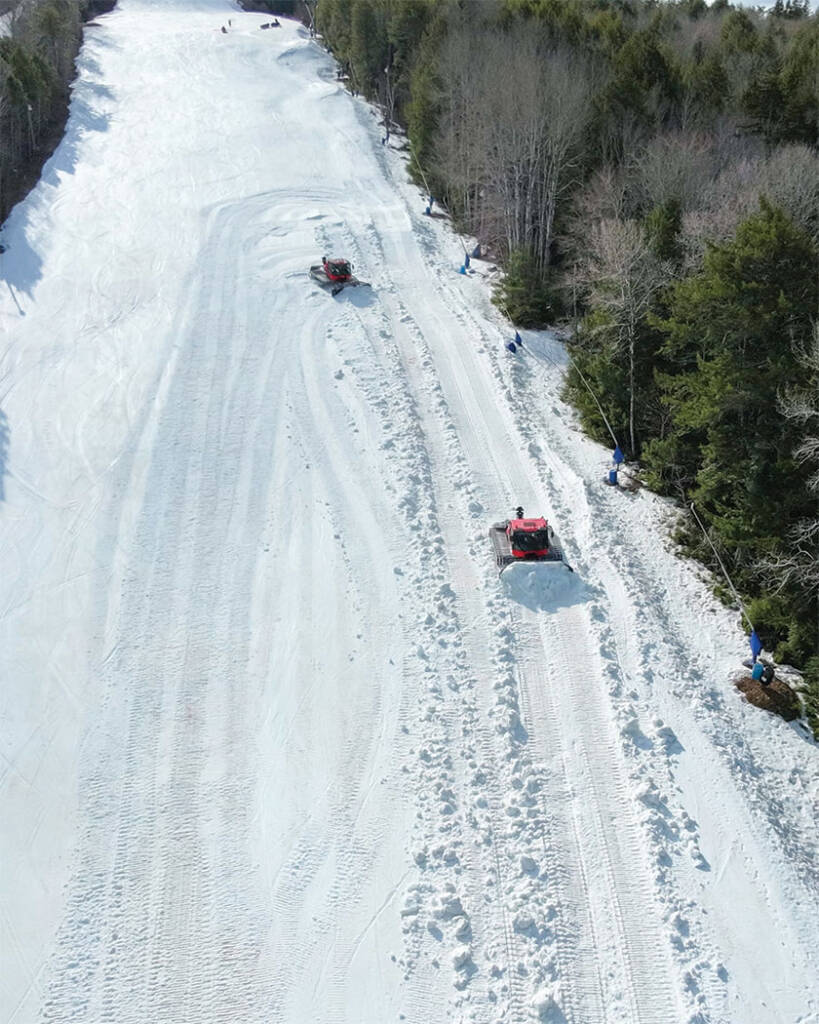 Large snow moving equipment on mountain