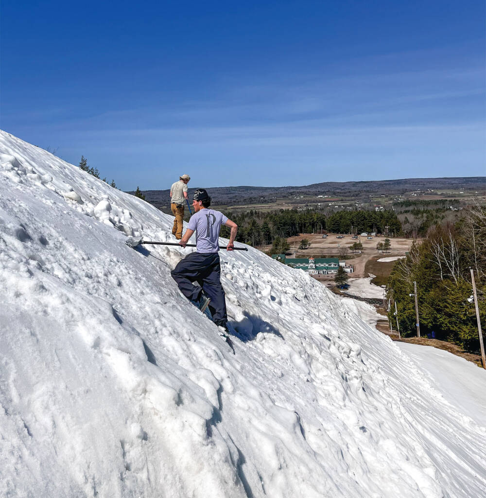 Workers digging side of mountain