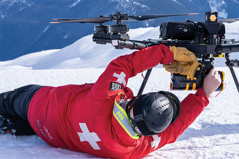 Ski patroller prepares the MONTIS payload on the ground