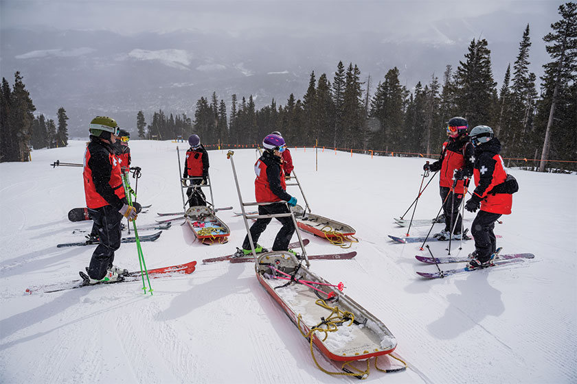 Ski patrol on mountain top